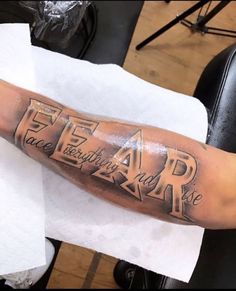 a man's arm with some writing on it