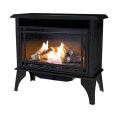 a black fire place sitting on top of a white floor