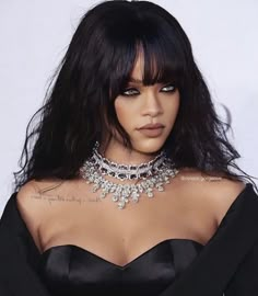 a close up of a person wearing a choker and dress with jewelry on her neck