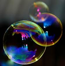 two soap bubbles floating in the air