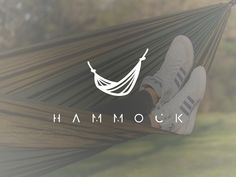 a person sitting in a hammock with their feet up on the hammock