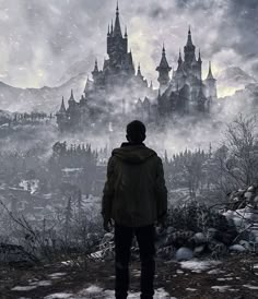 a man standing on top of a snow covered hillside looking at a castle in the distance