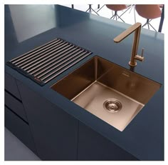 a stainless steel kitchen sink under a faucet