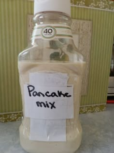 a bottle of pancake mix sitting on top of a counter