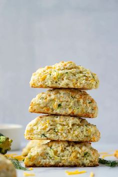 broccoli and cheese biscuits stacked on top of each other