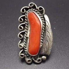 "VINTAGE NAVAJO RING DESCRIPTION: This classic ring features a lovely specimen of old red Mediterranean coral. The gemstone is secure in smooth bezel, on a foundation of heavy gauge vintage sterling silver. This ring will be a treasured addition to your collection of fine vintage Native American jewelry. MEASUREMENTS: Ring face measures 1 3/8\" x 5/8\" RING SIZE: 6 WEIGHT: 7.5 grams SIGNED: BJ STERLING: unmarked, verified sterling silver" Collectible Red Engraved Ring, Vintage Collectible Rings With Large Stone, Vintage Rings With Large Stone For Collectible, Vintage Rings With Large Stone For Collectors, Vintage Silver Ring With Large Stone, Vintage Sterling Silver Ring With Large Stone, Vintage Sterling Silver Rings With Large Stone, Vintage Jewelry With Large Stone In Open Ring, Vintage Sterling Silver Ring With Polished Finish