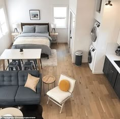 an aerial view of a living room, kitchen and bedroom area in a studio apartment