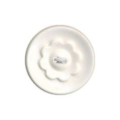 a white button with a flower on it