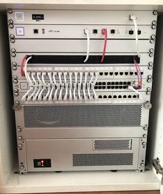 the back side of a server with wires attached to it's front and sides