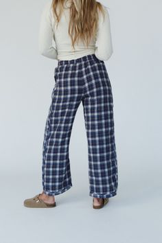 Introducing the Prairie Plaid Pants - the perfect pants for adding a touch of bohemian style to your wardrobe without sacrificing the comfort! Comfortable, mineral washed fabric with plaid pattern detailing Relaxed and loose wide leg silhouette Classic elastic waistband with adjustable ribbon for flattering fit Convenient side pockets (we love pockets!) Curved hem for added style and movement Pair with: High Neck Racerback Brami, Cozy Cabin Turtleneck Poncho and Gizelle Necklace. *Due to lightin Fall Straight Leg Harem Pants For Loungewear, Cotton Wide-leg Bottoms For Casual Gatherings, Fall Harem Pants For Loungewear, Straight Leg, Fall Casual Wide Leg Bottoms, Fall Wide Leg Bottoms For Casual Gatherings, Relaxed Fit Plaid Pants For Fall, Wide Leg Bottoms For Fall Casual Gatherings, Wide Leg Bottoms For Casual Gatherings In Fall, Relaxed Fit Bottoms For Casual Fall Gatherings