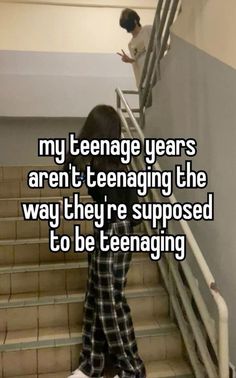 a person walking up some stairs with the words, my teenage years aren't teenagering