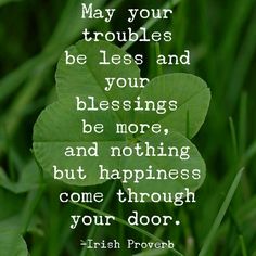 a four leaf clover sitting in the grass with a quote from irish prove on it