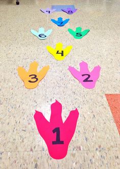 the numbers are arranged on the floor to spell out what is in each hand and how do they get?