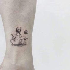 a woman's foot with a small tattoo on the side of her leg and an image of a dog