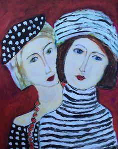 two women with hats on their heads are looking at each other while one is holding the other's neck