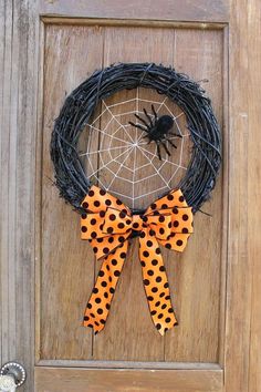 a wreath decorated with polka dots and a spider