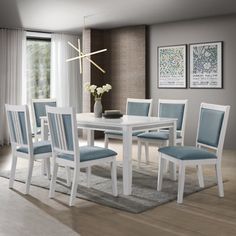 a white table with blue chairs in a room