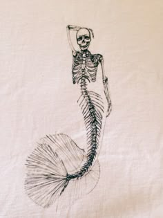 a drawing of a skeleton mermaid holding a fish tail