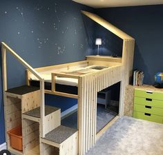 there is a loft bed with stairs in the room