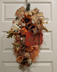 a christmas wreath hanging on the front door