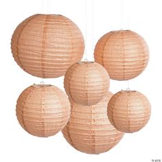 four round paper lanterns hanging from the ceiling