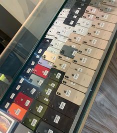 there are many different colored boxes on display