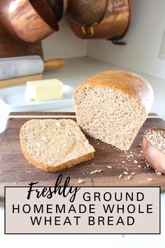 a loaf of bread sitting on top of a wooden cutting board next to sliced bread