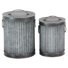 two metal canisters sitting next to each other