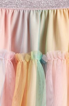 Get your kiddo ready to twist and twirl in this rainbow-tulle skirt topped with a metallic elastic waist for a hint of sparkle. Elastic waist Lined 100% polyester Machine wash, tumble dry Imported