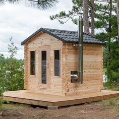 a small wooden cabin in the woods