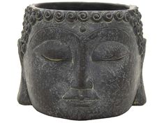 a black buddha head planter with eyes closed