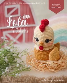 a crocheted chicken sitting on top of a nest