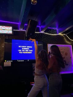 two women are dancing in front of a tv with the words do every single thing on it