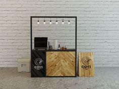 the counter is made out of wood and has lights hanging from it's sides