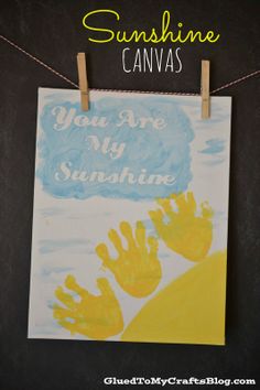 a handprinted sunflower on a clothes line with the words, you are my sunshine