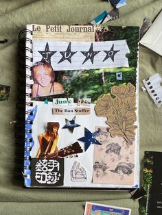 an open journal with pictures and stickers on it