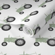 a green and white wallpaper with tractors on it