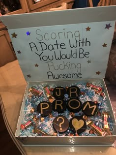 a box filled with candies and chocolates on top of a table