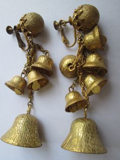 Nice vintage pair of signed Haskell gilt gold brass bell dangle drop earrings one earrings is missing two bells other wise in good shape and measure 3 1/4 inches. Vintage Metal Chandelier Earrings For Festive Occasions, Vintage Festive Metal Chandelier Earrings, Vintage Dangle Chandelier Earrings For Festive Occasions, Vintage Chandelier Dangle Earrings For Festive Occasions, Vintage Festive Dangle Chandelier Earrings, Vintage Brass Dangle Clip-on Earrings, Festive Vintage Brass Earrings, Vintage Brass Earrings With Latkans, Vintage Gold Chandelier Earrings For Festive Occasions