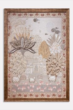 an embroidered wall hanging with flowers and animals