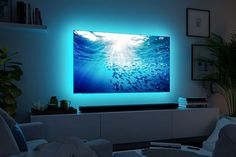 13 Small Home Theatre Room Ideas and Layouts - GoTinySpace Led Lights On Tv, Led Lights Around Tv, Tv Led Lights, Snug Ideas