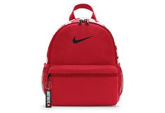 Nike Brasilia JDI Boys /Girls Mini BackPack The Nike Brasilia JDI unisex mini BackPack is small but convenient. Made from recycled polyester fabric featuring adjustable Padded shoulder straps, this BackPack has a Just Do It keychain and screen print for some seriously cool vibes. A double-zippered main compartment offers plenty of room, while the smaller front pocket keeps items like your wallet and keys easily within reach.  Made with at least 20% recycled content by weight. Move Red Nike School Bag, Nike Red Travel Bag, Red Nike Travel Bag, Backpack Nike, Mochila Nike, Backpack Ideas, Backpack Accessories, Cool Vibes, Backpack Reviews