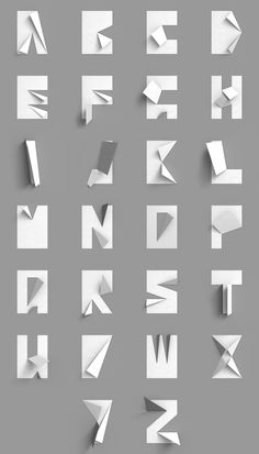 an image of some type of paper cut out into letters and numbers on a gray background