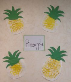 four pineapples cut out from construction paper and placed on top of each other