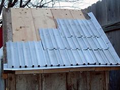 a metal roof on top of a wooden building