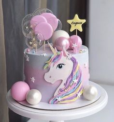 there is a unicorn cake on the table