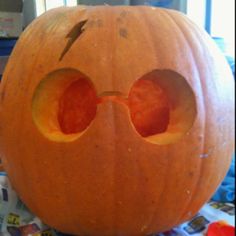 an orange pumpkin with two holes in it