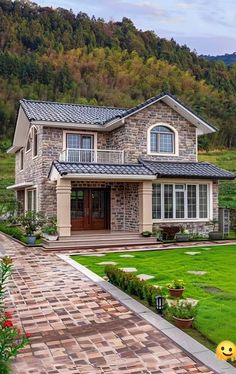 a large house with a stone walkway leading to the front door