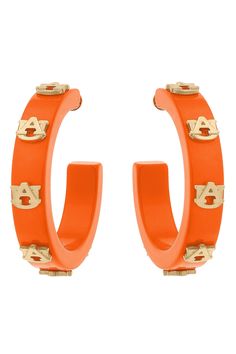 Make the perfect game-day fashion statement with the Auburn Tigers Resin Hoops! These stylish hoop earrings are made of resin with worn gold logo charms attached. The bold color makes it the perfect tailgate accessory. Resin Logo, Perfect Game, Auburn Tigers, Tailgate Accessories, Resin Material, Gold Logo, Bold Color, Shirt Accessories, Sale Event