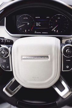 the steering wheel and dashboard of a car